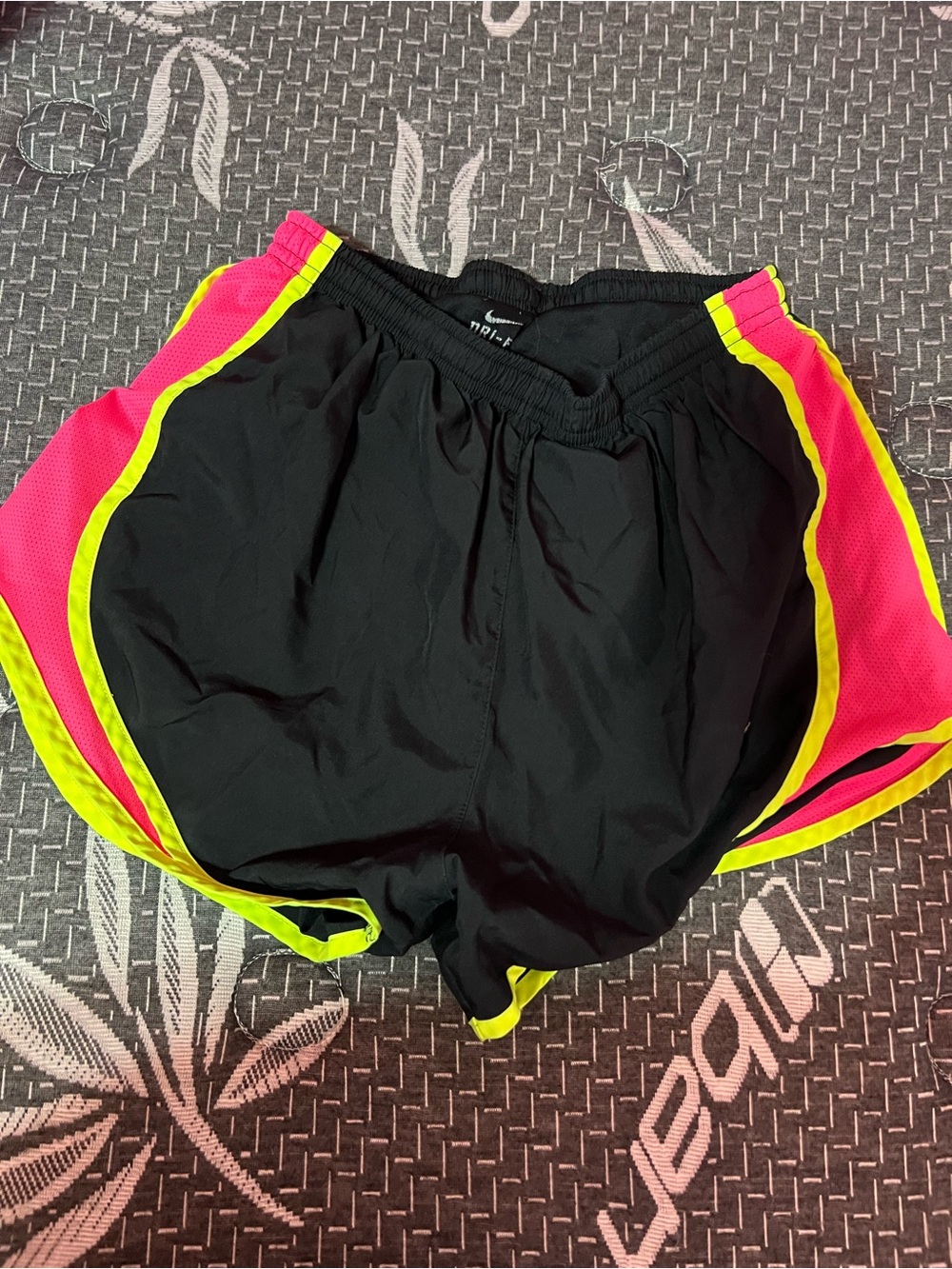 Nike Women's Black Athletic Shorts with Neon Pink Panels and Yellow Trim